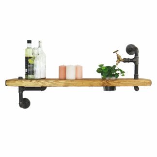 Reclaimed wooden shelf with raw steel industrial pipe brackets and decorative tap detailing