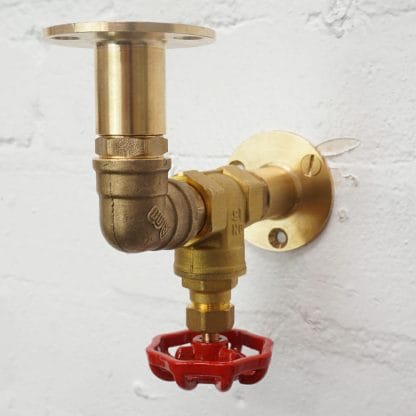brass industrial pipe shelf bracket with red tap valve detailing