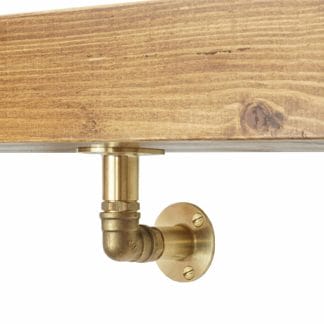 Brass elbow industrial pipe shelf bracket close up