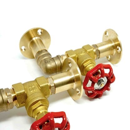 Brass industrial pipe shelf brackets with red valves