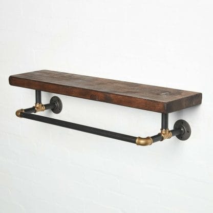 raw steel industrial pipe shelf with brass elbows, hanging rail and dark wood reclaimed shelf