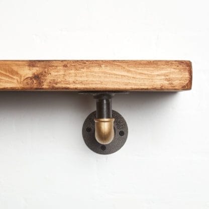 raw steel brass curved elbow shelf bracket close up reclaimed wood shelf