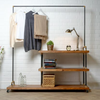 Raw-Steel-And-Brass-Clothes-Rail-with-Long-Reclaimed-Timber-Shelving