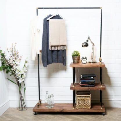 Raw-Steel-And-Brass-Clothes-Rail-with-Reclaimed-Timber-Shelving-2